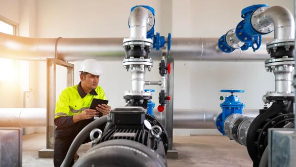 Maintenance engineers inspect the system of pumping stations and pipes delivering clean water and water storage tanks for the community.; Shutterstock ID 2352660705; purchase_order:XA; job:; client:; other: