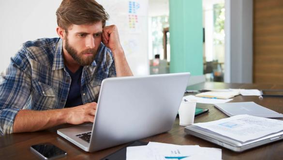 Businessman Sitting At Desk In Office Working On Laptop
WebDAM Path: /Photography & Illustration/Stock Photography/People
