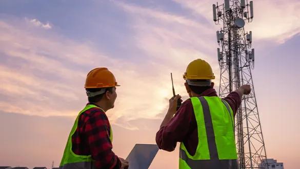 Workers by tower landscape