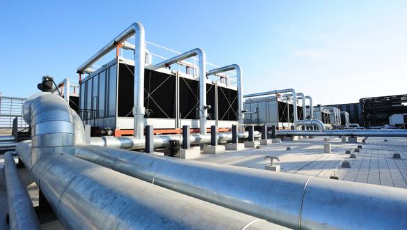 Sets of cooling towers in data center building.