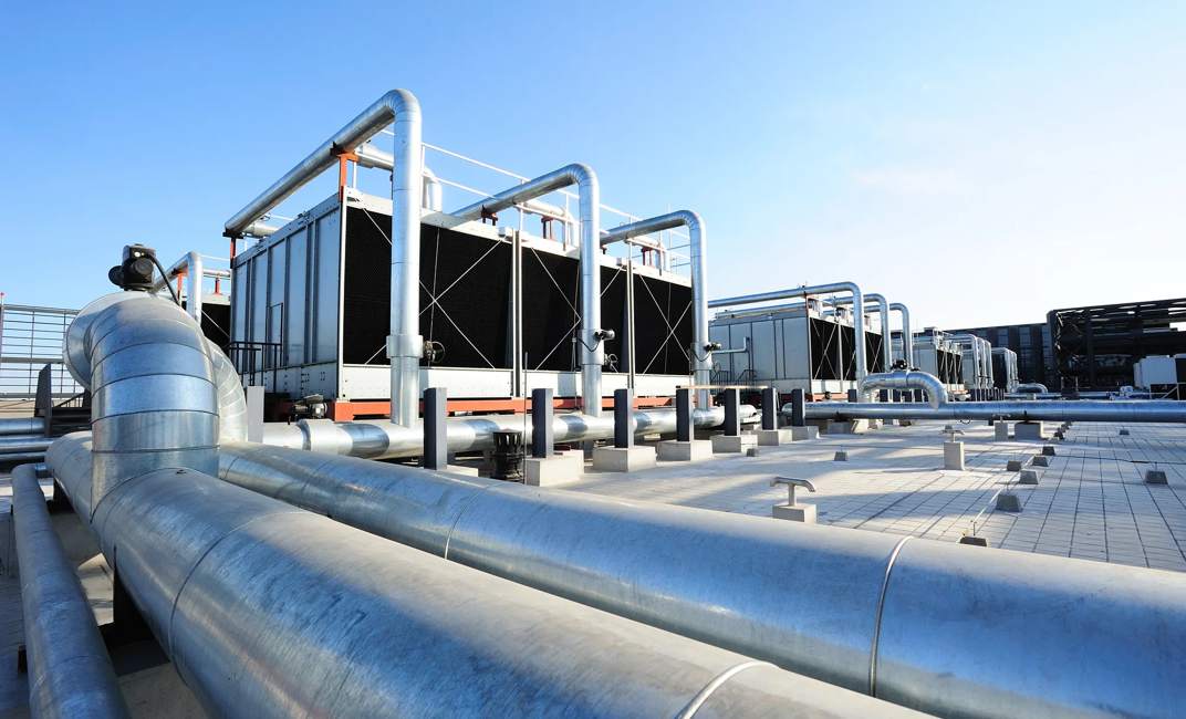 Sets of cooling towers in data center building.