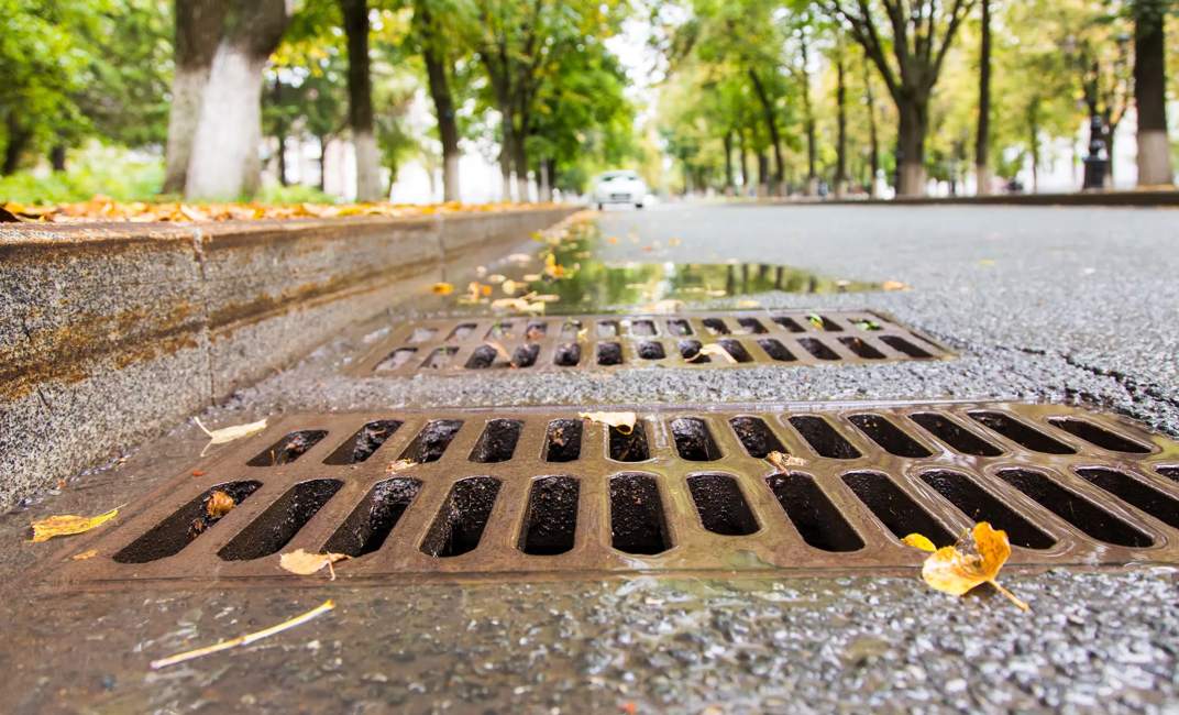 Rain water flows down the hatch cover on a sunny autumn day.drain on the roadside
WebDAM Path: /Photography & Illustration/Stock Photography/Natural Disasters
