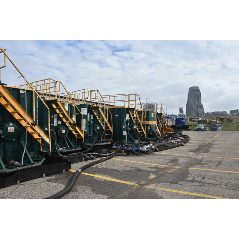 This image was taken in Grand Rapids, Michigan of a PFAS remediation site which includes dewatering, pumps, pipes mobile granular activated carbon and our mobile fleet