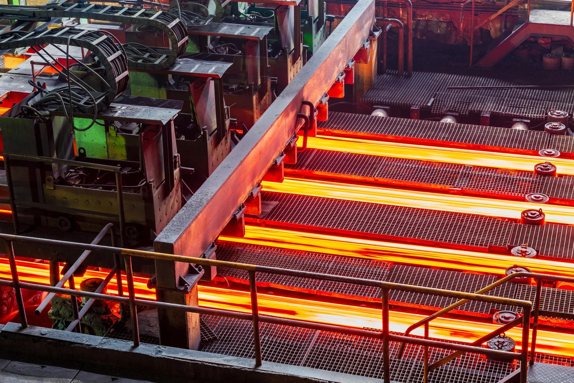 Red hot steel bars on the conveyor belt during the production process in a steel plant; Shutterstock ID 2652752289; purchase_order: Marketing AW EMEA campaign; job: ; client: ; other: 